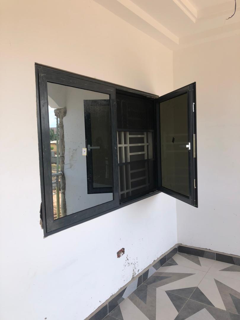 Aluminium casement window with security mesh fitted in a finished AMH unit