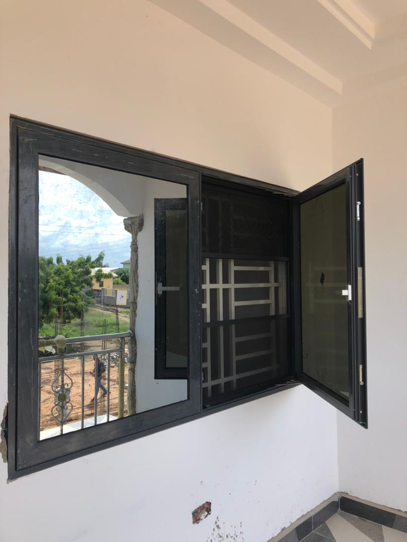 Sliding and casement window combination installed in a completed room